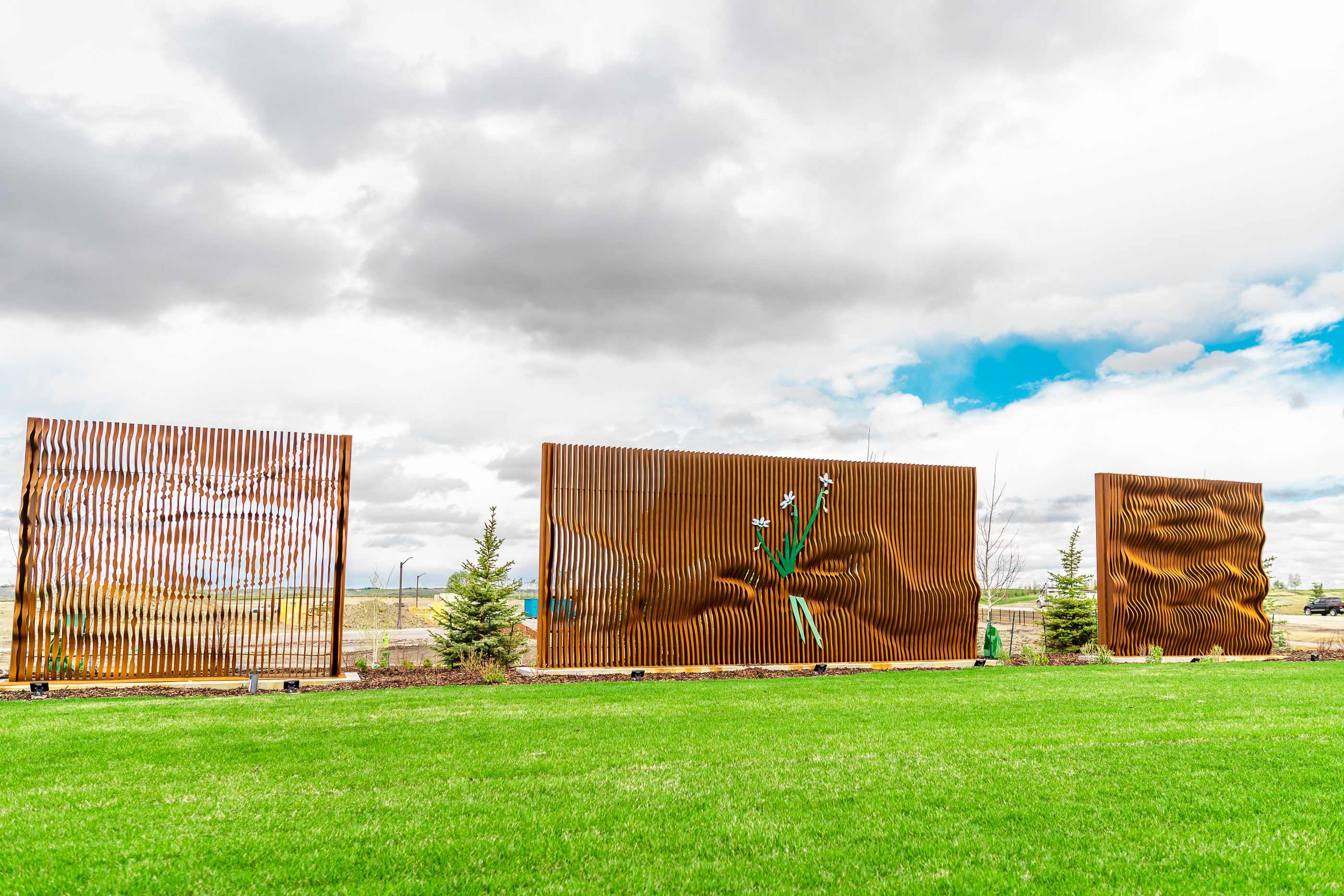 Gordon Skilling’s “[Re]newal - Profound Cycles”. In the centre of the piece, two hands are passing a rare species of grass.