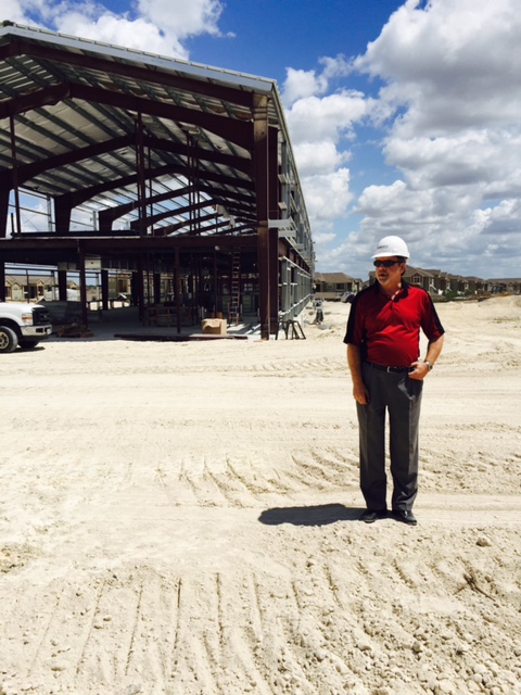 Brain Higgins stands at Qualico's regional office construction site in the USA
