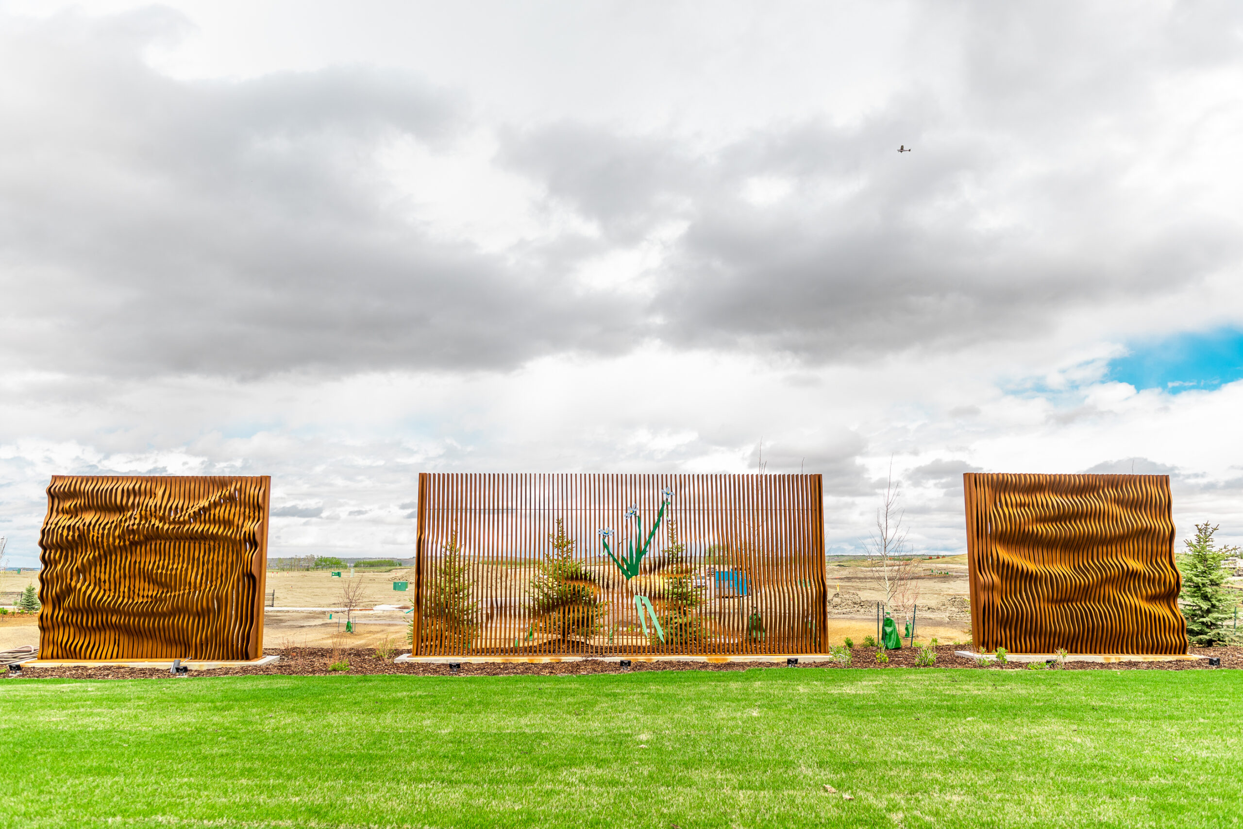 Gordon Skilling’s “[Re]newal - Profound Cycles”. In the centre of the piece, two hands are passing a rare species of grass.