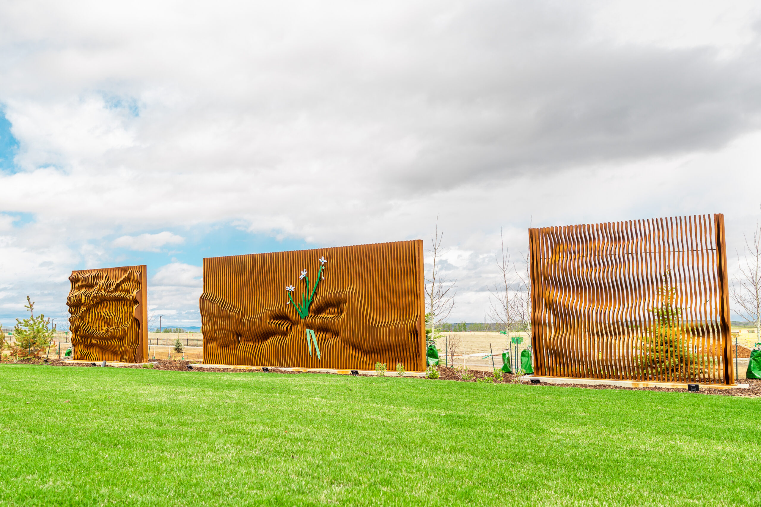 Gordon Skilling’s “[Re]newal - Profound Cycles”. In the centre of the piece, two hands are passing a rare species of grass.
