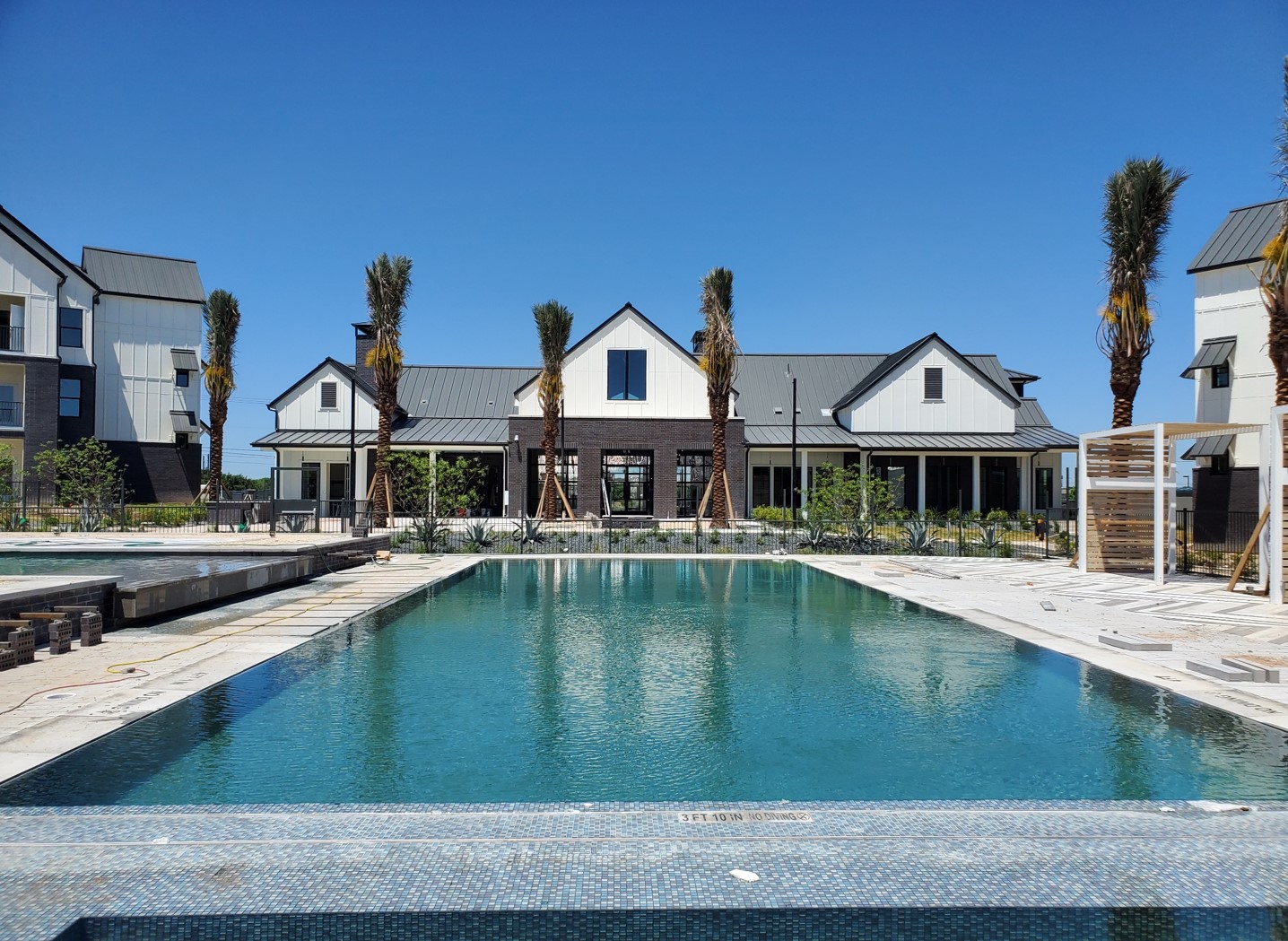 three-storey poolside multi family dwelling